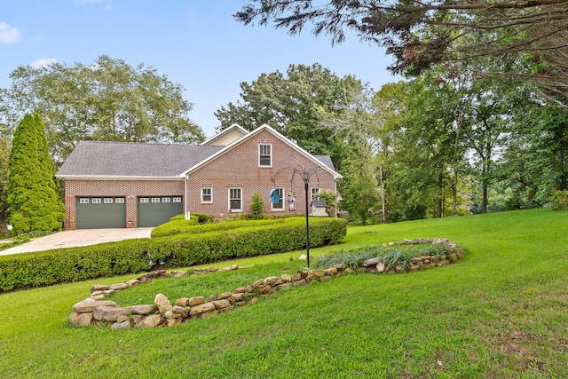 view of front of home with a garage and a front lawn