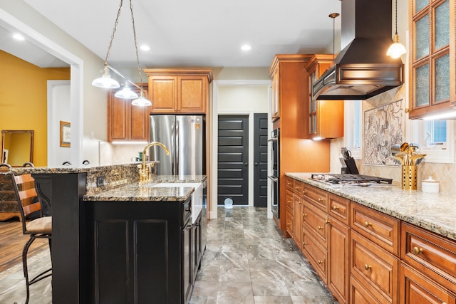 kitchen featuring hanging light fixtures, custom exhaust hood, a kitchen breakfast bar, and appliances with stainless steel finishes