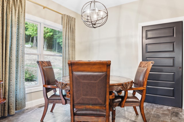 dining space with an inviting chandelier