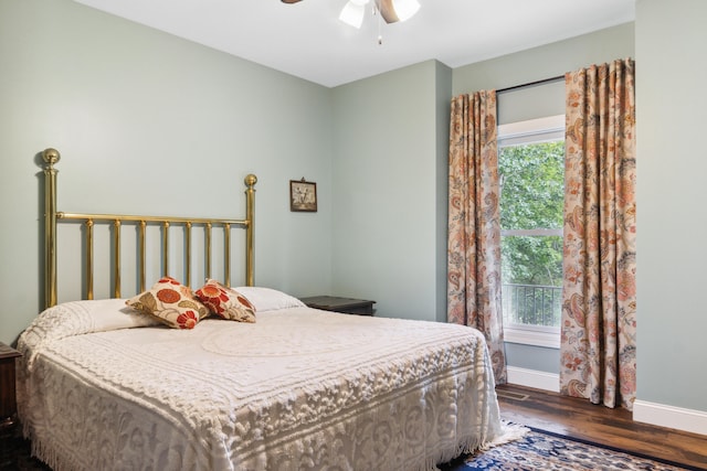 bedroom with dark wood-type flooring and ceiling fan