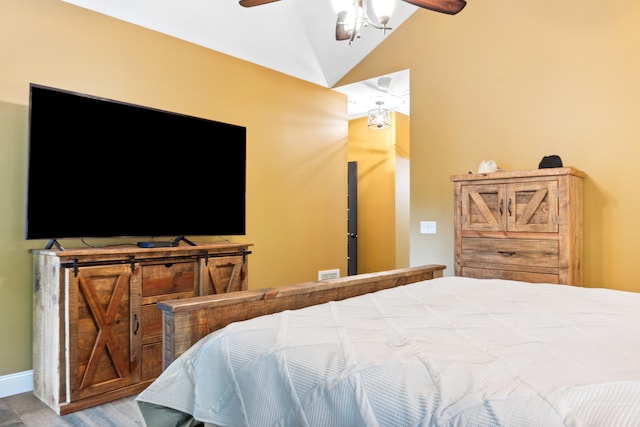 bedroom featuring vaulted ceiling and ceiling fan