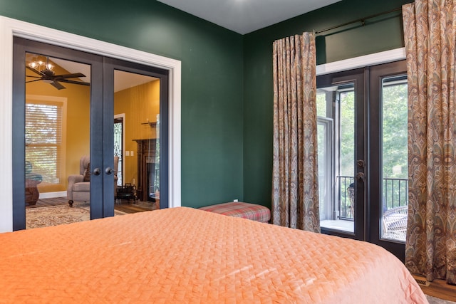 bedroom featuring hardwood / wood-style flooring, french doors, and access to outside