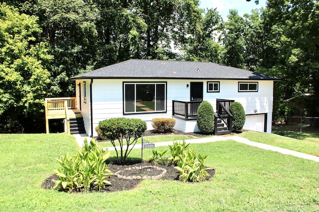 ranch-style home with a front lawn and a deck