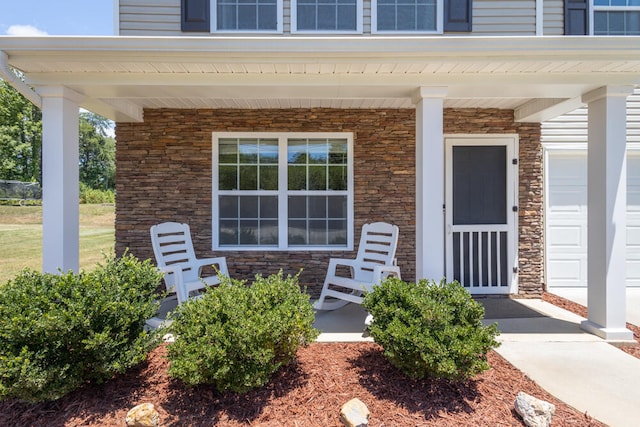 doorway to property with covered porch