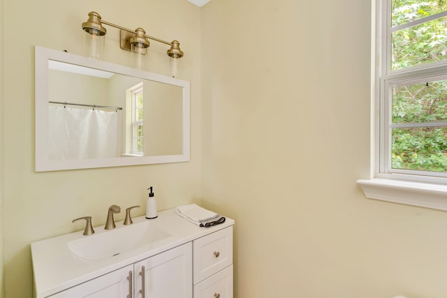 bathroom with vanity and curtained shower