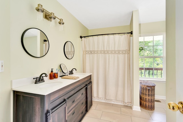 bathroom featuring tile patterned floors, walk in shower, and vanity