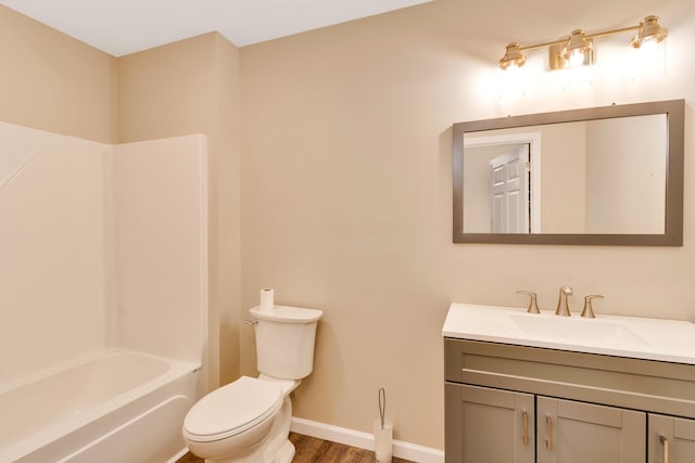 full bathroom featuring vanity, toilet, hardwood / wood-style flooring, and bathing tub / shower combination