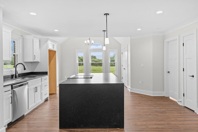 kitchen featuring white cabinetry, wood-type flooring, stainless steel dishwasher, and sink