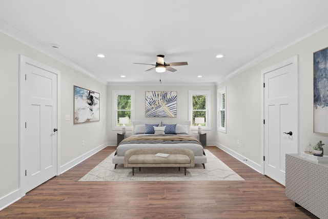 bedroom featuring dark wood-type flooring, ceiling fan, and ornamental molding