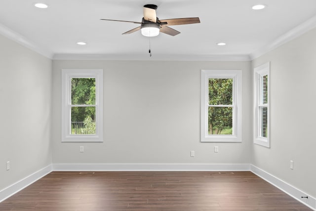 empty room featuring ceiling fan, dark hardwood / wood-style flooring, and ornamental molding