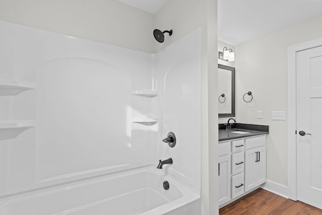 bathroom featuring vanity, shower / tub combination, and hardwood / wood-style flooring