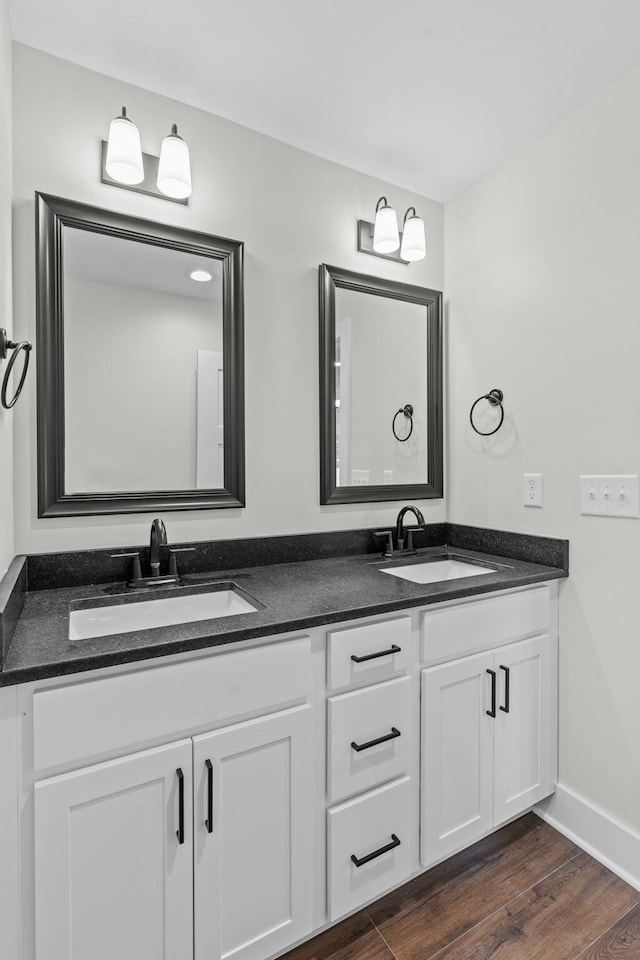 bathroom featuring wood-type flooring and vanity