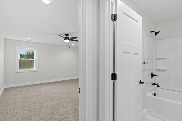 bathroom with bathtub / shower combination and ceiling fan