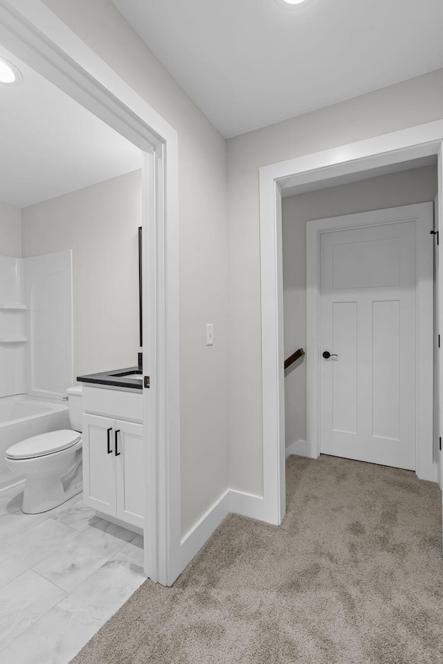 interior space with vanity, toilet, and bathing tub / shower combination