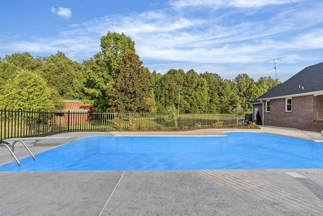 view of swimming pool featuring a patio