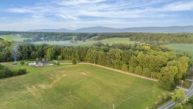 drone / aerial view featuring a mountain view and a rural view