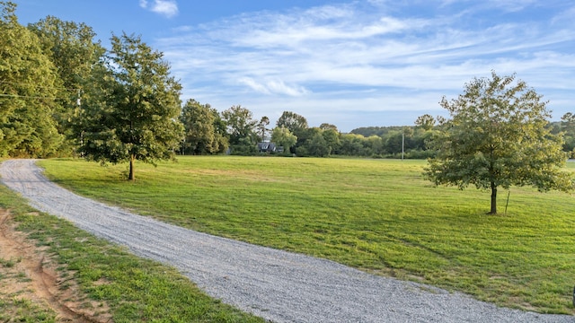 exterior space with a lawn and a rural view