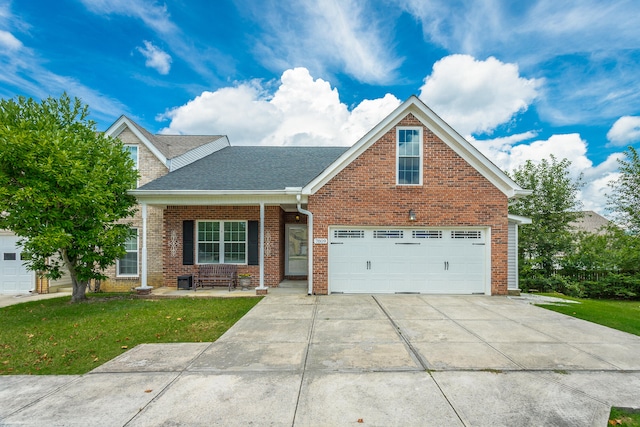 view of front of house featuring a garage and a front lawn