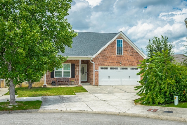 view of front of house with a garage and a front yard