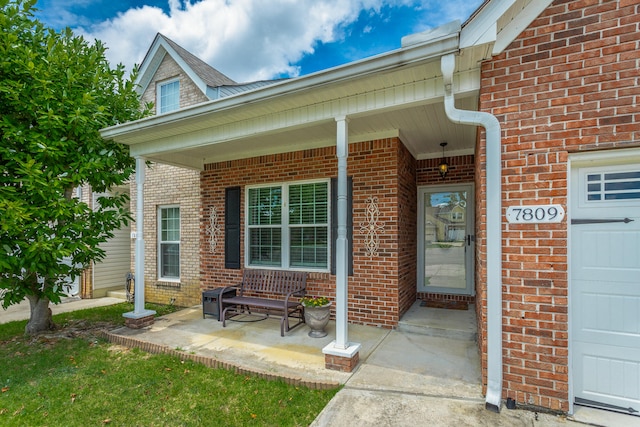 property entrance featuring covered porch