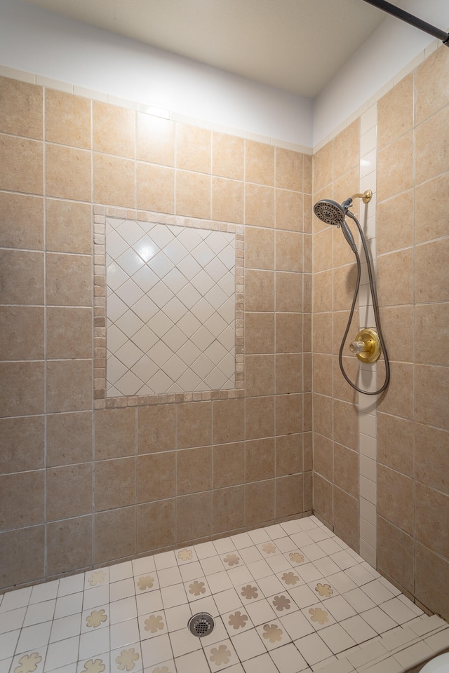 bathroom with tiled shower