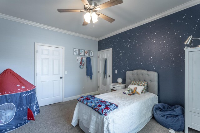 carpeted bedroom featuring crown molding and ceiling fan