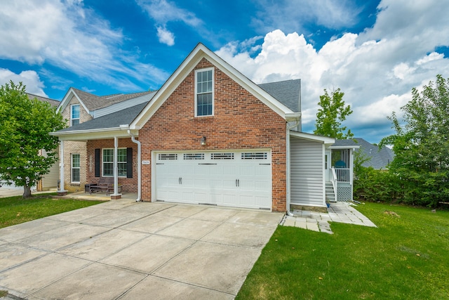 view of front of house with a front lawn and a garage