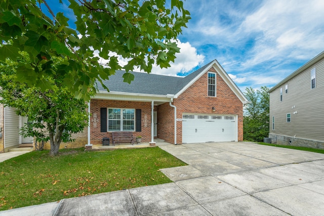 view of front of home with central AC, a garage, and a front lawn