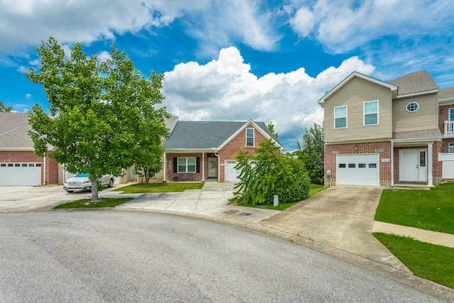 view of front of home featuring a front yard and a garage