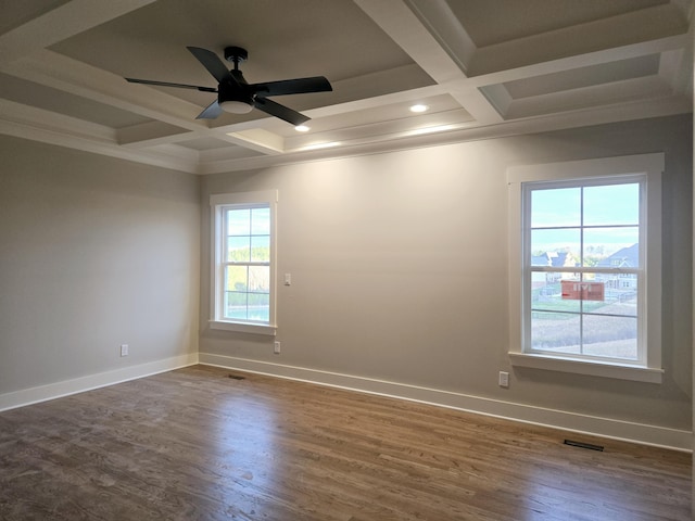 unfurnished room with coffered ceiling, dark hardwood / wood-style floors, ceiling fan, ornamental molding, and beam ceiling