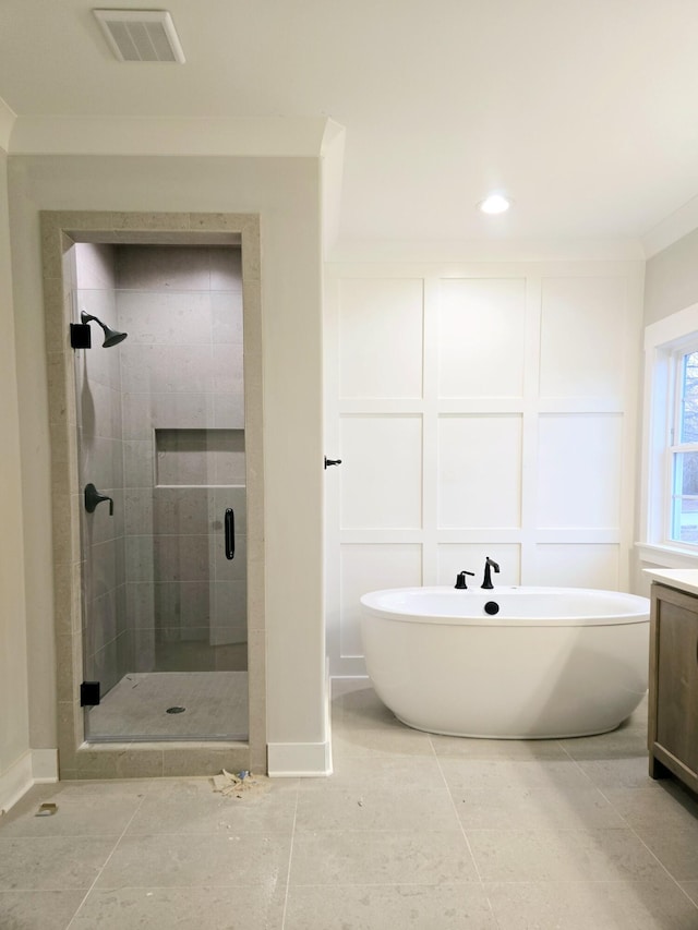 bathroom featuring tile patterned flooring, vanity, ornamental molding, and independent shower and bath