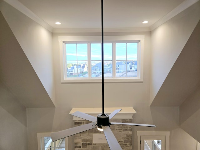 interior details featuring ceiling fan and crown molding