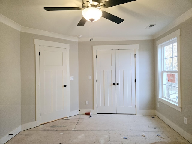 unfurnished bedroom with a closet, ceiling fan, and crown molding