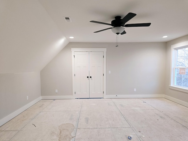 additional living space featuring ceiling fan and lofted ceiling