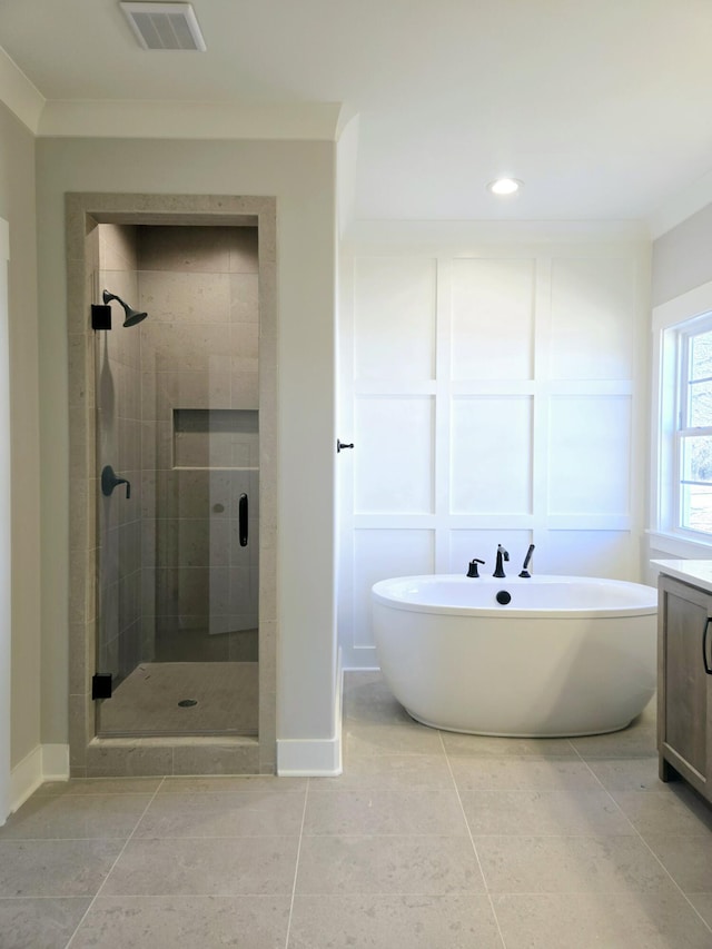 bathroom with tile patterned floors, vanity, shower with separate bathtub, and ornamental molding