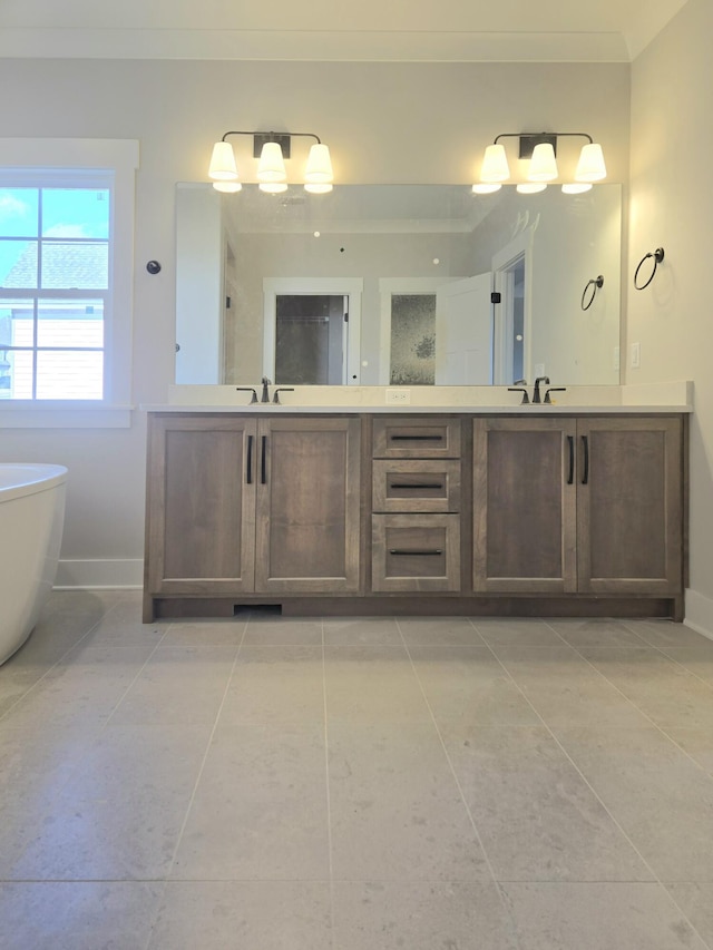 bathroom with vanity, a washtub, and tile patterned floors