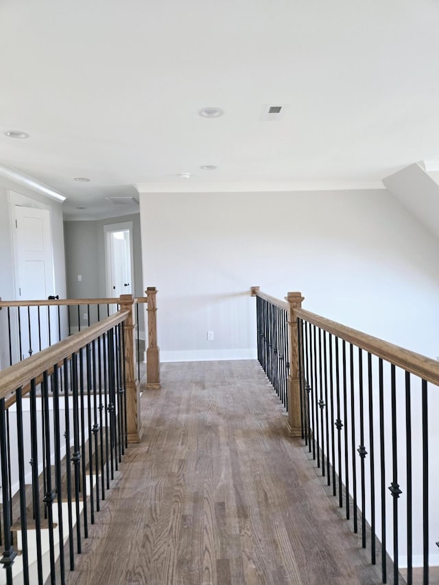 hallway with hardwood / wood-style flooring