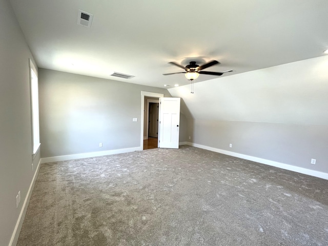 bonus room with visible vents, ceiling fan, and carpet