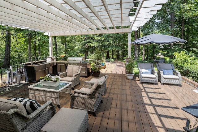 deck featuring a pergola, an outdoor kitchen, outdoor lounge area, and a grill