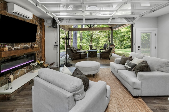 sunroom with a wall unit AC and a fireplace