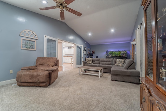 living room featuring lofted ceiling, ceiling fan, recessed lighting, baseboards, and carpet