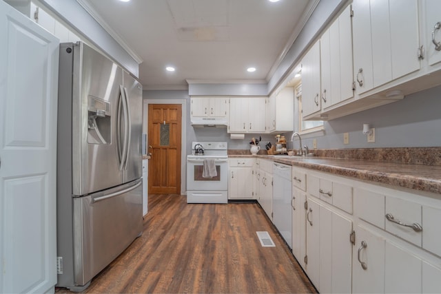 kitchen featuring white appliances, under cabinet range hood, white cabinetry, and a sink