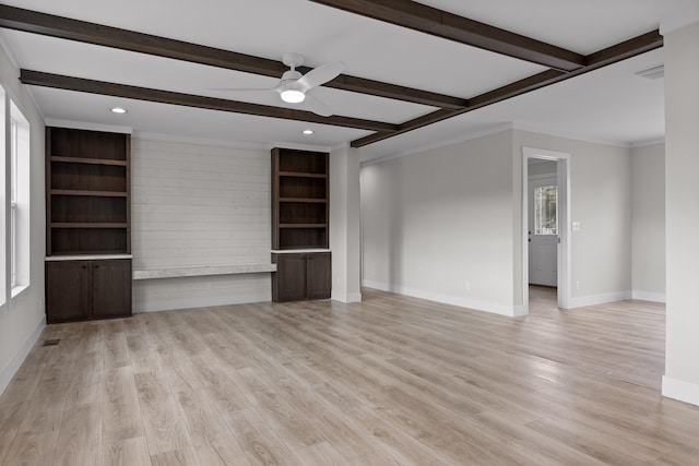 unfurnished living room with ornamental molding, light wood-type flooring, beamed ceiling, and ceiling fan