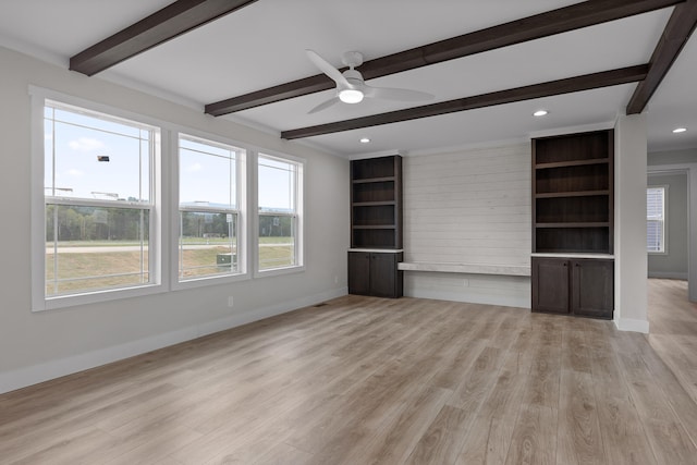 unfurnished living room featuring beamed ceiling, light hardwood / wood-style flooring, and ceiling fan