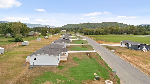 birds eye view of property featuring a mountain view