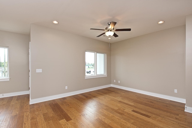 unfurnished room with wood-type flooring and ceiling fan