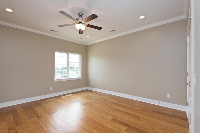 unfurnished room with ceiling fan, ornamental molding, and wood-type flooring