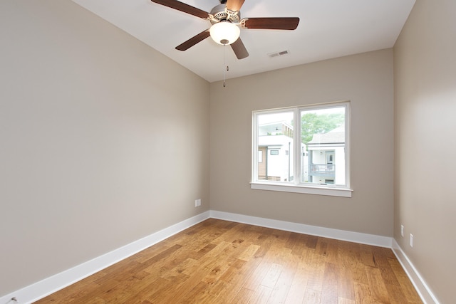 spare room featuring ceiling fan and light hardwood / wood-style floors