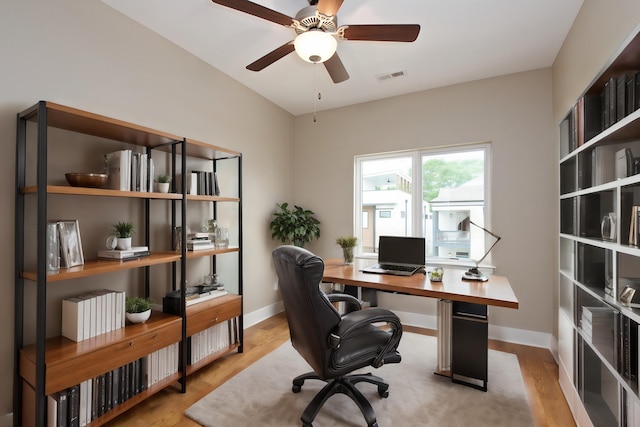 office area with ceiling fan and light hardwood / wood-style flooring