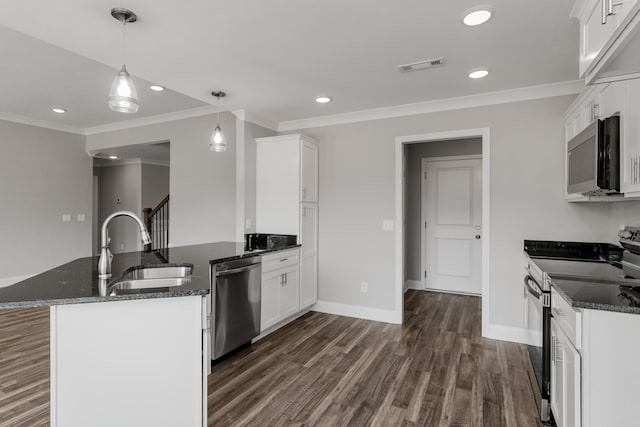 kitchen featuring white cabinets, sink, stainless steel appliances, dark stone counters, and dark hardwood / wood-style flooring